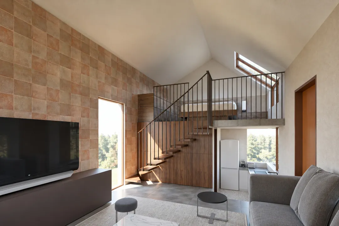 The double-height living room: terracotta tile wall, walnut stair rising to the loft, grey Kota floor