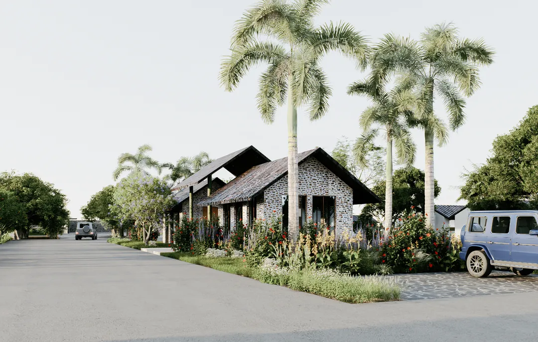The homes along the street in daylight, a garden at every gate